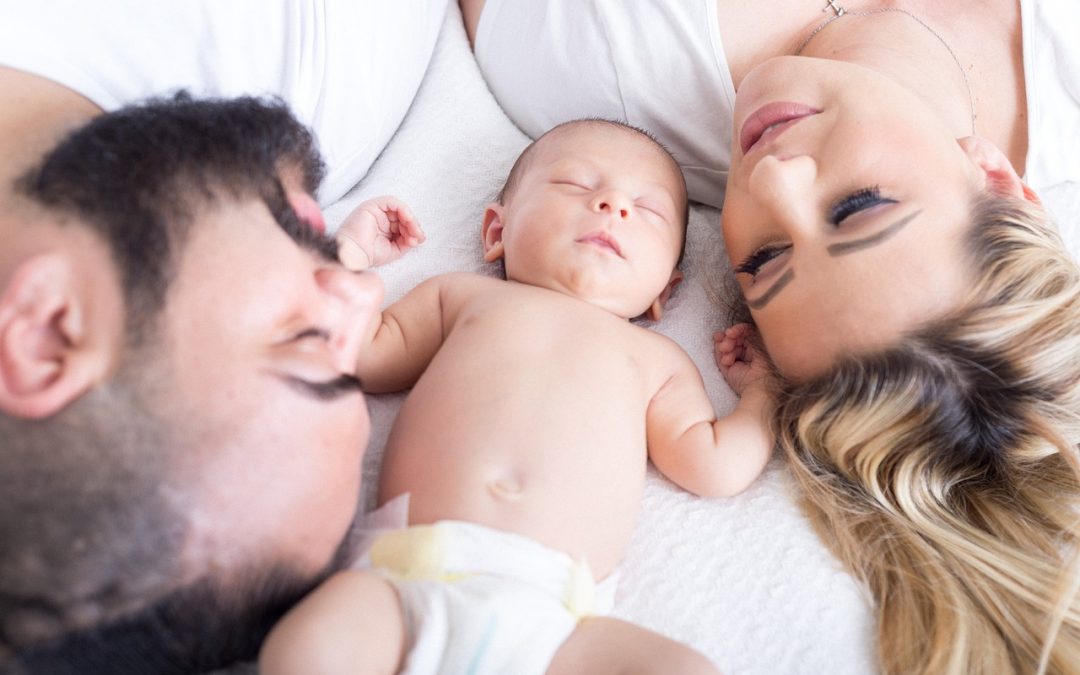 Family with sleeping newborn | Long Island NY Newborn Sleep Consultant | Sleep Rest and Play